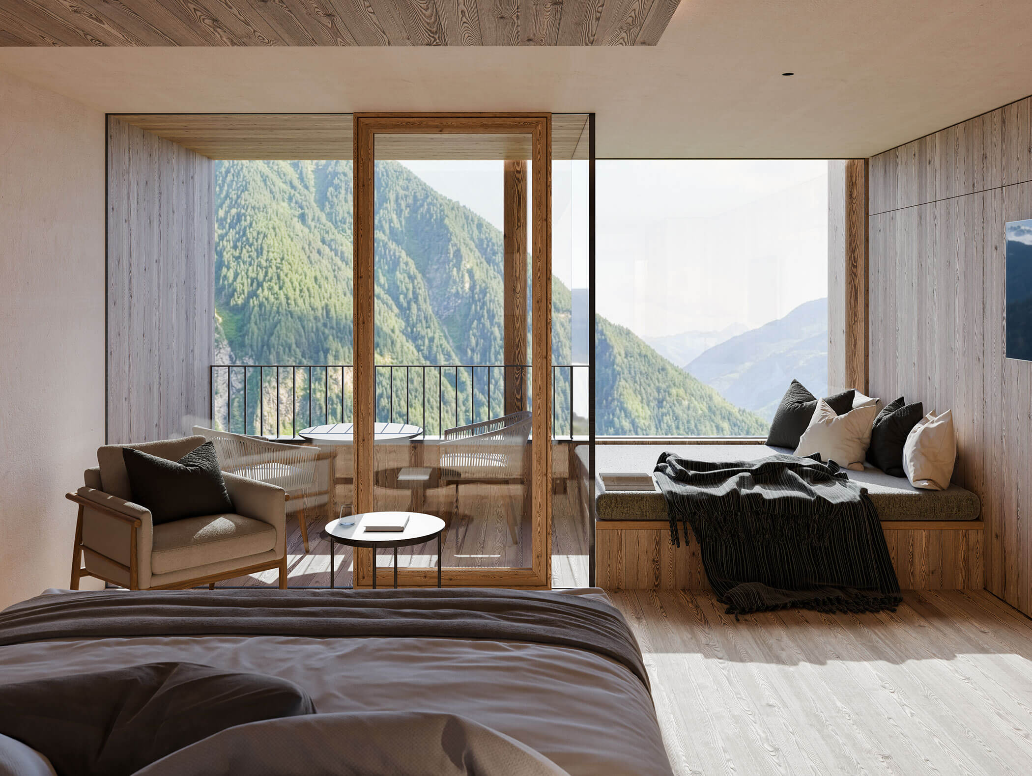 Camera da letto moderna con ampie finestre, vista sulle montagne, balcone, area salotto e accenti in legno naturale. - Hotel Moosmair